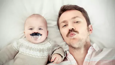 Portrait of a father with his son, both with mustaches